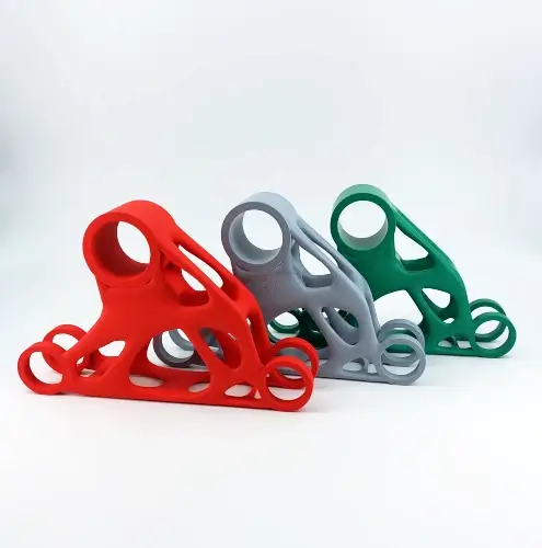 PA 12 W colorfully dyed and treated with shot peening - three topology-optimized sample parts