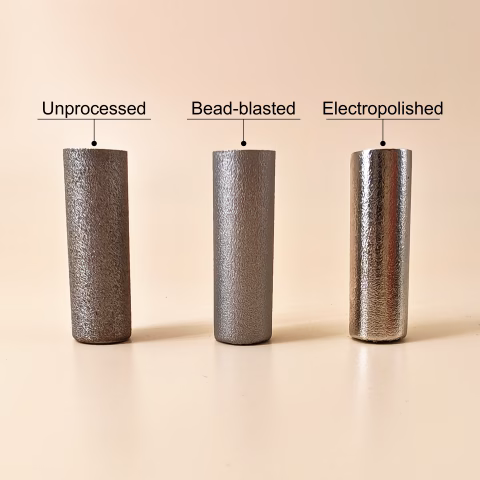 Three 3D printed cylindrical samples of stainless steel 316L with different surface finishing options